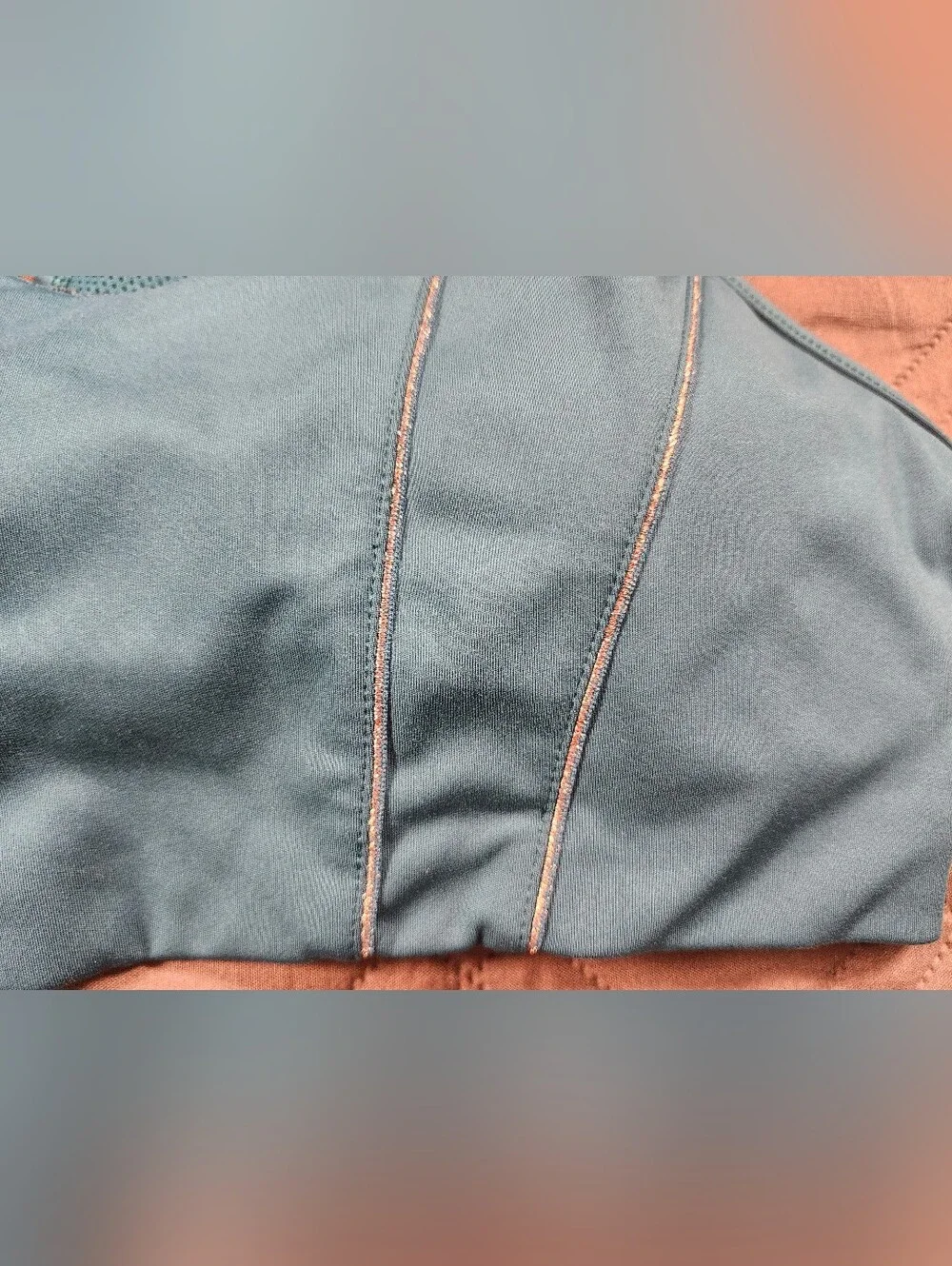 teal Nike Dri-FIT Indy light-support sports bra sparkling metallic tape accents